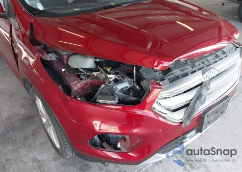 2017 Ford Escape Titanium z USA, uszkodzony, nr VIN 1FMCU0J98HUD29348